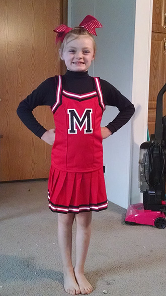 Obie in cheerleader uniform